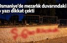 Osmaniye'de mezarlık duvarındaki o yazı dikkat çekti