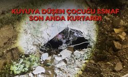 Kuyuya düşen çocuğu esnaf son anda kurtardı